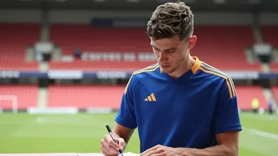 League One Rivals Secure Big Name Transfers as AFC Wimbledon Focuses on Homegrown Talent